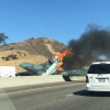 WWII plane crashes on California freeway, pilot unharmed